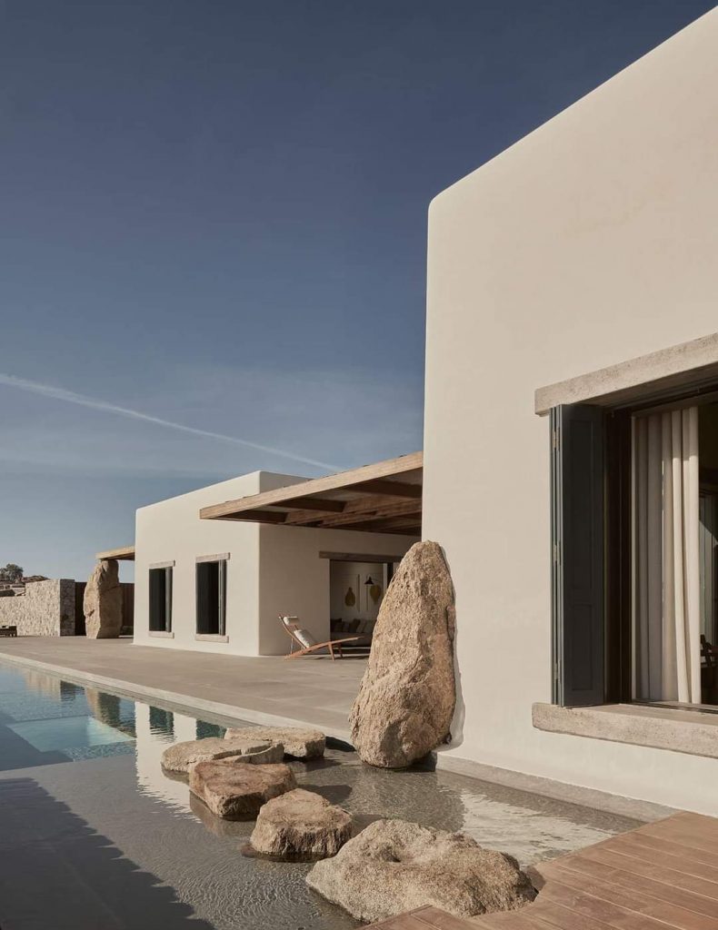 Modern eco-friendly home with unique architecture and natural materials, showcasing the design flexibility of straw-insulated panels.