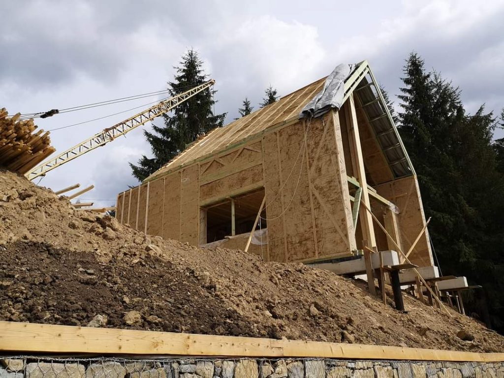 Straw panel house under construction, demonstrating the durability and solid structure of eco-friendly building materials designed to last over 120 years.